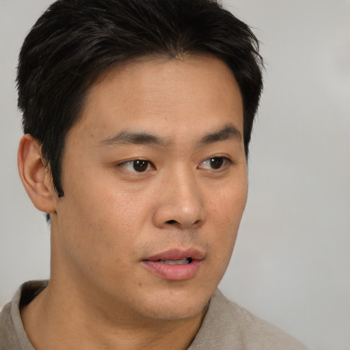 Neutral asian young-adult male with short  brown hair and brown eyes