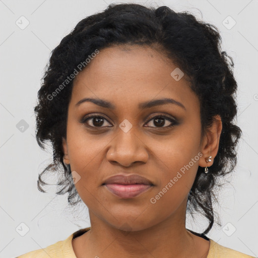 Joyful black young-adult female with long  black hair and brown eyes