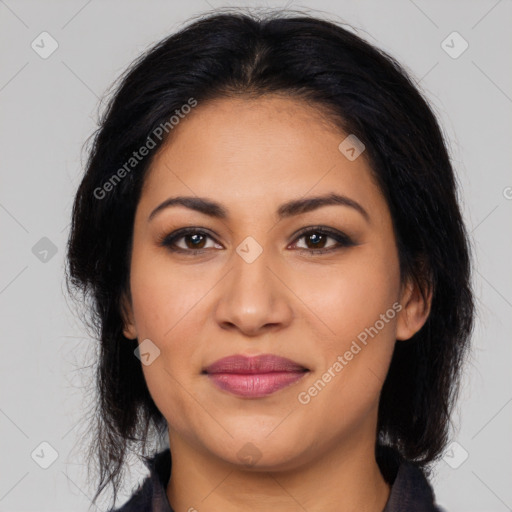 Joyful latino young-adult female with long  brown hair and brown eyes