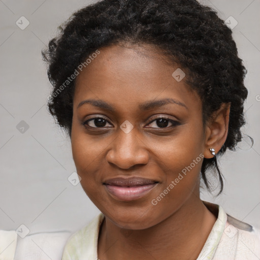 Joyful black young-adult female with medium  black hair and brown eyes