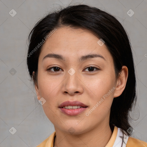 Joyful asian young-adult female with medium  black hair and brown eyes