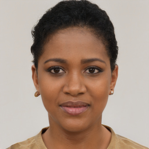 Joyful black young-adult female with short  black hair and brown eyes
