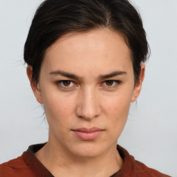 Neutral white young-adult female with short  brown hair and brown eyes