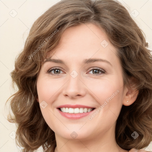 Joyful white young-adult female with long  brown hair and green eyes