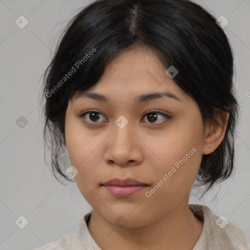 Joyful asian young-adult female with medium  black hair and brown eyes