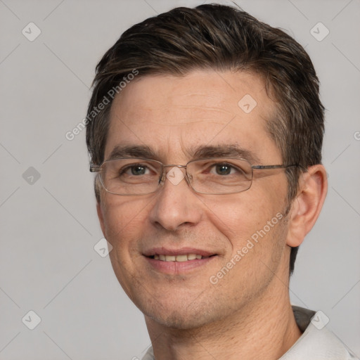 Joyful white adult male with short  brown hair and brown eyes