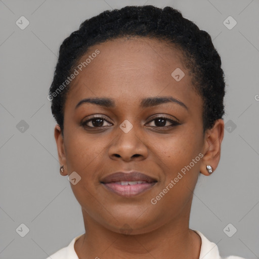 Joyful black young-adult female with short  black hair and brown eyes