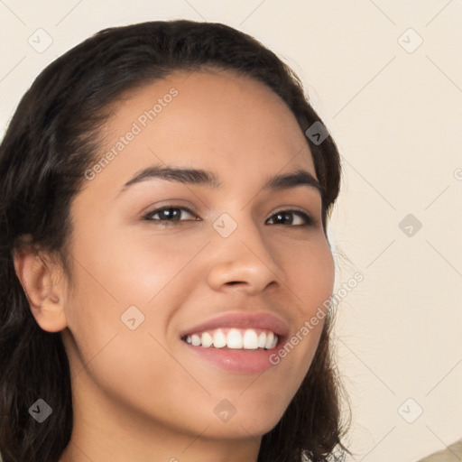 Joyful latino young-adult female with long  brown hair and brown eyes