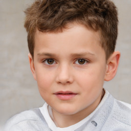 Joyful white child male with short  brown hair and brown eyes