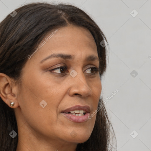 Joyful white adult female with long  brown hair and brown eyes