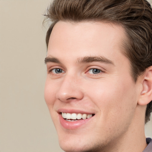 Joyful white young-adult male with medium  brown hair and brown eyes