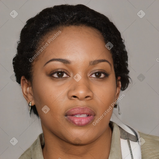 Joyful black young-adult female with medium  brown hair and brown eyes