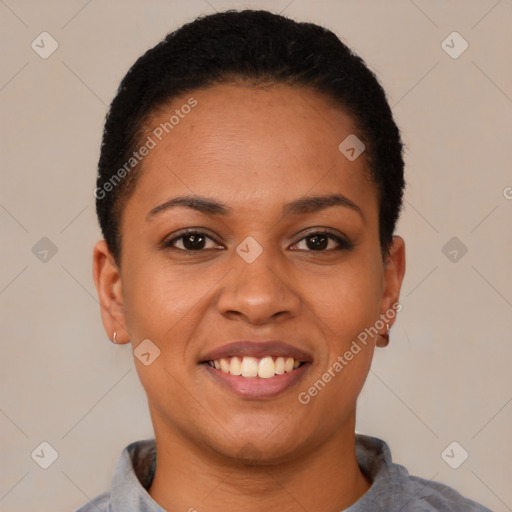 Joyful black young-adult female with short  black hair and brown eyes