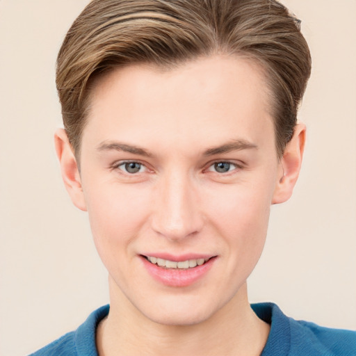 Joyful white young-adult male with short  brown hair and grey eyes