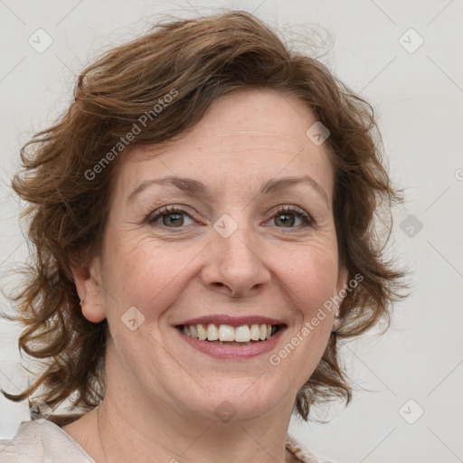 Joyful white adult female with medium  brown hair and blue eyes