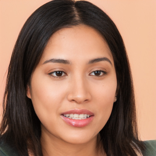 Joyful asian young-adult female with long  brown hair and brown eyes