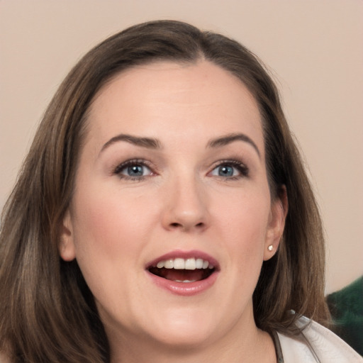 Joyful white young-adult female with medium  brown hair and brown eyes