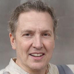 Joyful white middle-aged male with short  brown hair and brown eyes