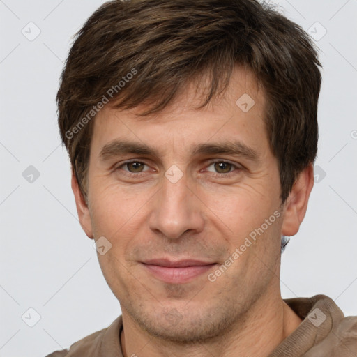 Joyful white adult male with short  brown hair and brown eyes