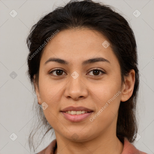 Joyful latino young-adult female with medium  brown hair and brown eyes