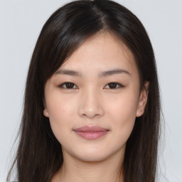 Joyful asian young-adult female with long  brown hair and brown eyes