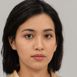 Neutral asian young-adult female with medium  brown hair and brown eyes