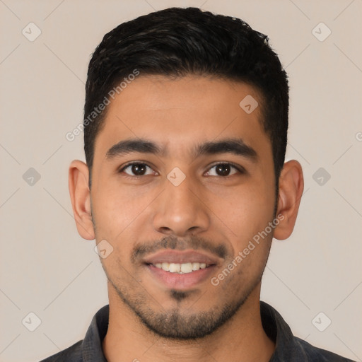 Joyful latino young-adult male with short  black hair and brown eyes