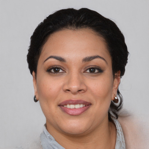 Joyful asian young-adult female with short  brown hair and brown eyes