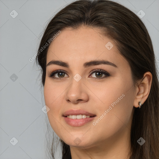 Joyful white young-adult female with long  brown hair and brown eyes