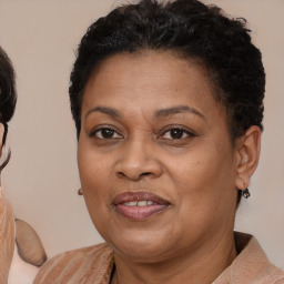 Joyful latino adult female with medium  brown hair and brown eyes