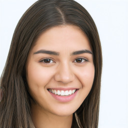 Joyful white young-adult female with long  brown hair and brown eyes