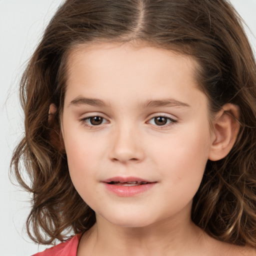 Joyful white child female with medium  brown hair and brown eyes