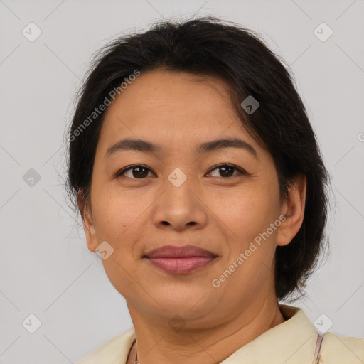 Joyful asian adult female with medium  brown hair and brown eyes