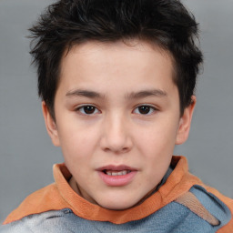 Joyful white child male with short  brown hair and brown eyes