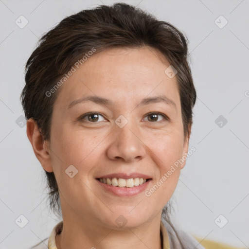 Joyful white adult female with short  brown hair and brown eyes