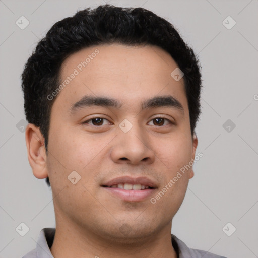 Joyful white young-adult male with short  black hair and brown eyes