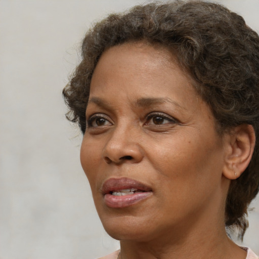 Neutral black adult female with short  brown hair and brown eyes