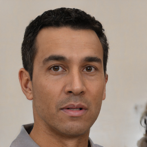 Neutral white young-adult male with short  black hair and brown eyes