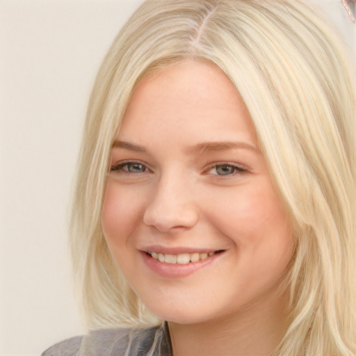 Joyful white young-adult female with medium  blond hair and brown eyes