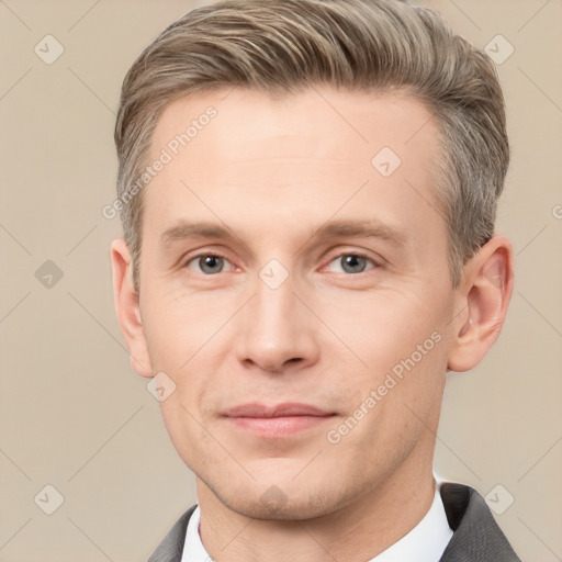 Joyful white adult male with short  brown hair and grey eyes