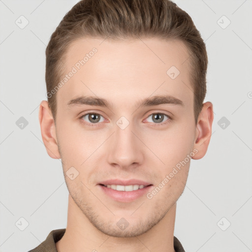 Joyful white young-adult male with short  brown hair and grey eyes