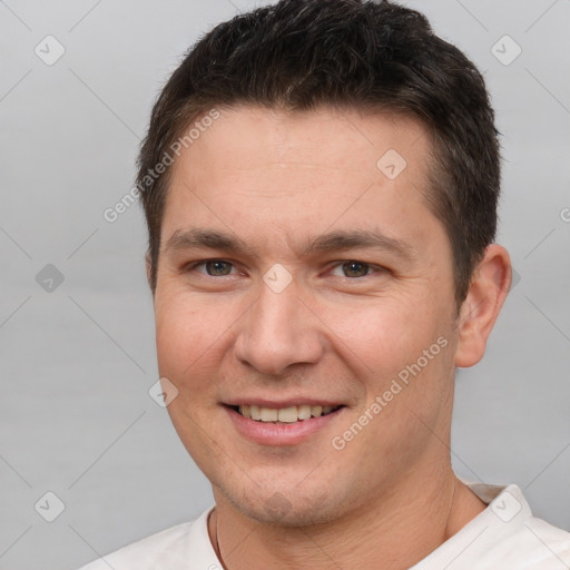 Joyful white young-adult male with short  brown hair and brown eyes