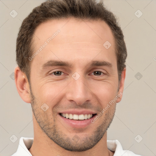 Joyful white adult male with short  brown hair and brown eyes