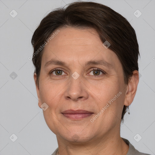 Joyful white adult female with short  brown hair and grey eyes