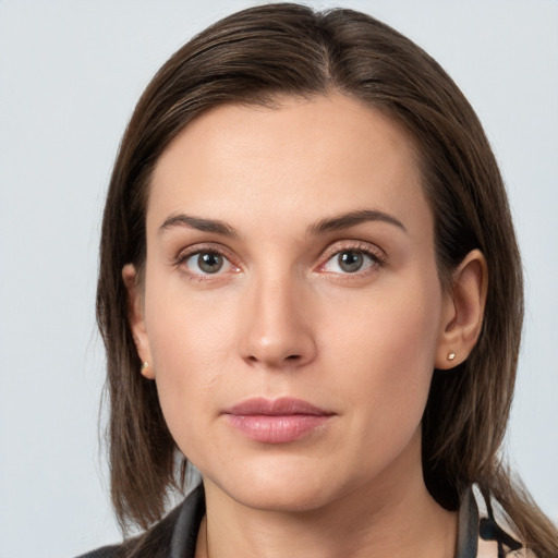 Neutral white young-adult female with medium  brown hair and grey eyes