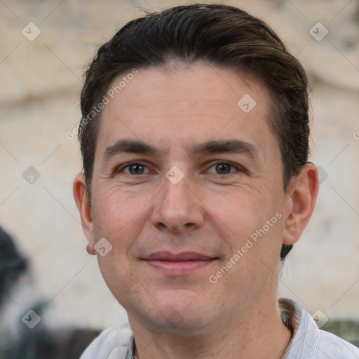 Joyful white adult male with short  brown hair and brown eyes