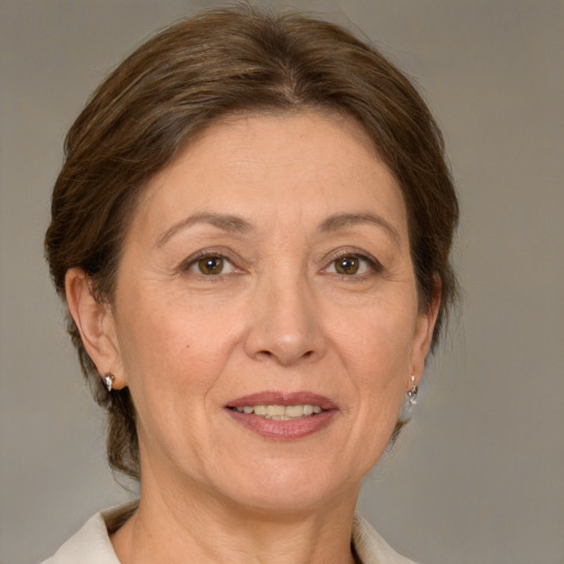 Joyful white adult female with medium  brown hair and brown eyes