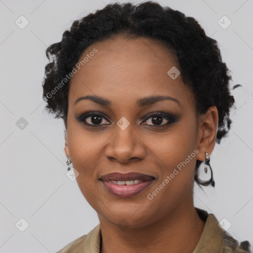 Joyful black young-adult female with short  black hair and brown eyes