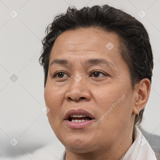 Joyful white adult female with short  brown hair and brown eyes