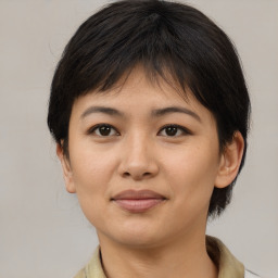 Joyful asian young-adult female with medium  brown hair and brown eyes